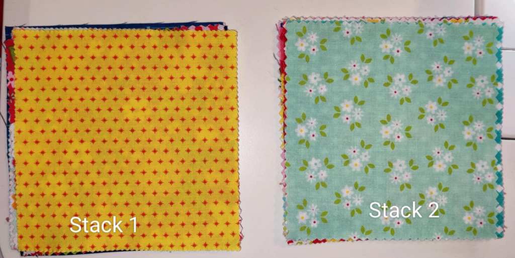 Charm pack separated into two stacks of 21.